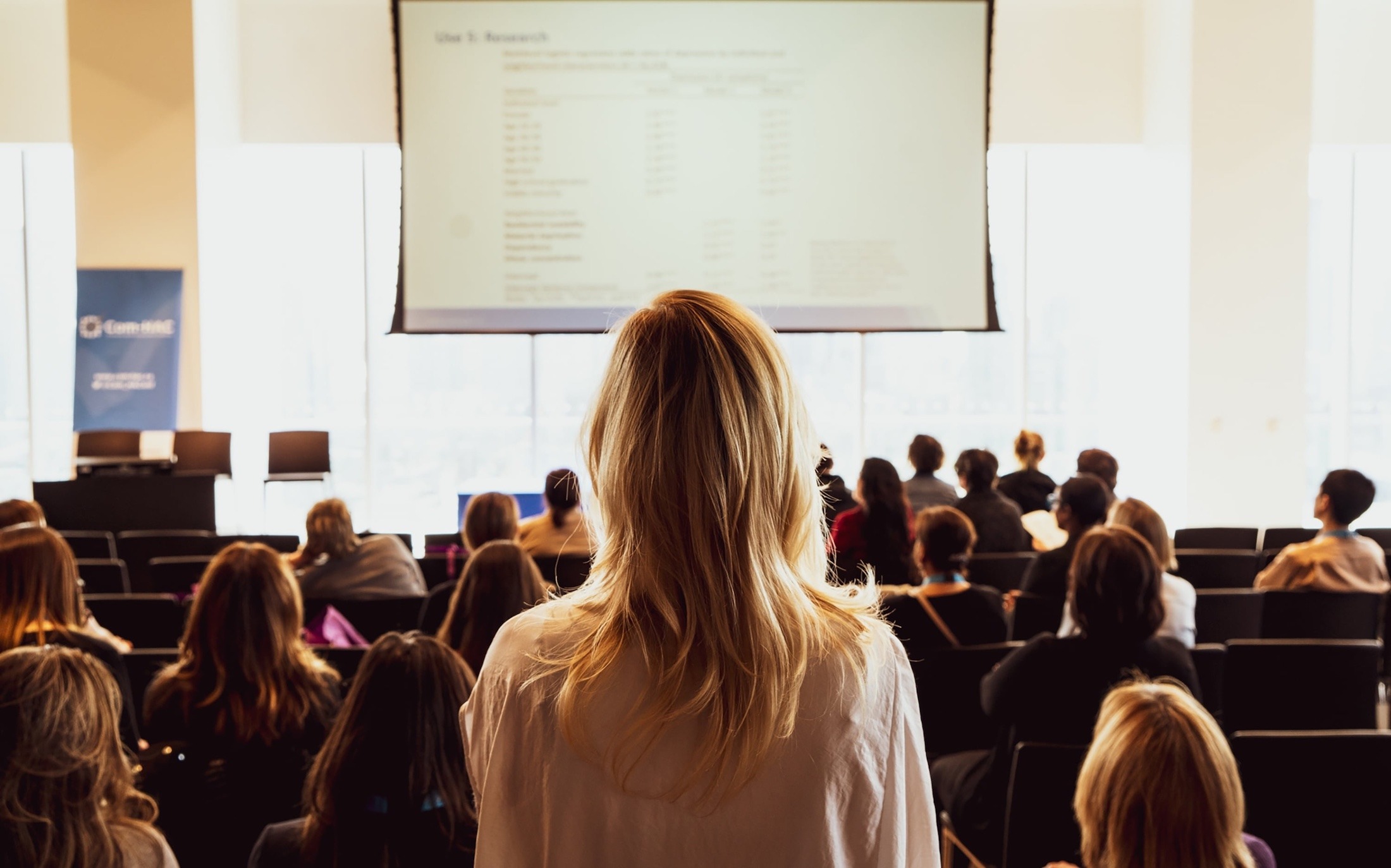 woman speaking at conference